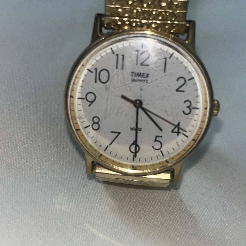 Vintage Gold Band Timex Watch. LA CELL. White Face. Metal Band. Needs Battery‎